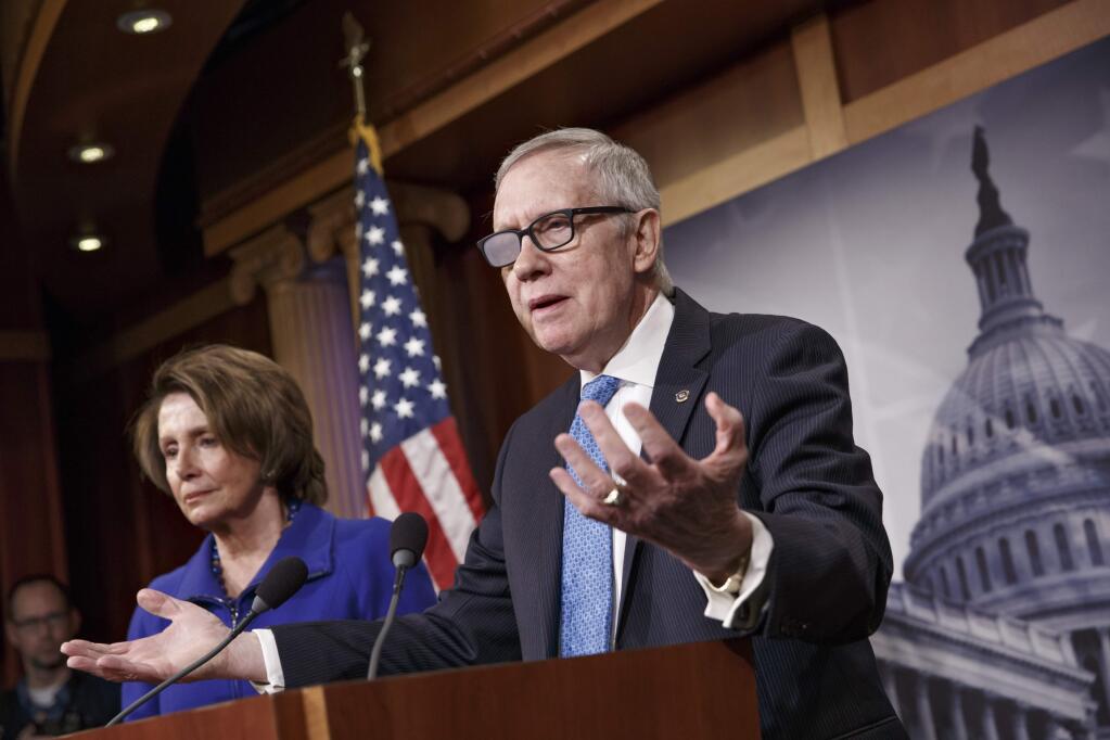 FILE - In this Feb. 26, 2015 file photo, Senate Minority Leader Harry Reid of Nev., accompanied by House Minority Leader Nancy Pelosi of Calif., gestures during a news conference on Capitol Hill in Washington. Reid is announcing he will not seek re-election to another term. The 75-year-old Reid says in a statement issued by his office Friday that he wants to make sure Democrats regain control of the Senate next year and that it would be 'inappropriate' for him to soak up campaign resources when he could be focusing on putting the Democrats back in power. (AP Photo/J. Scott Applewhite)