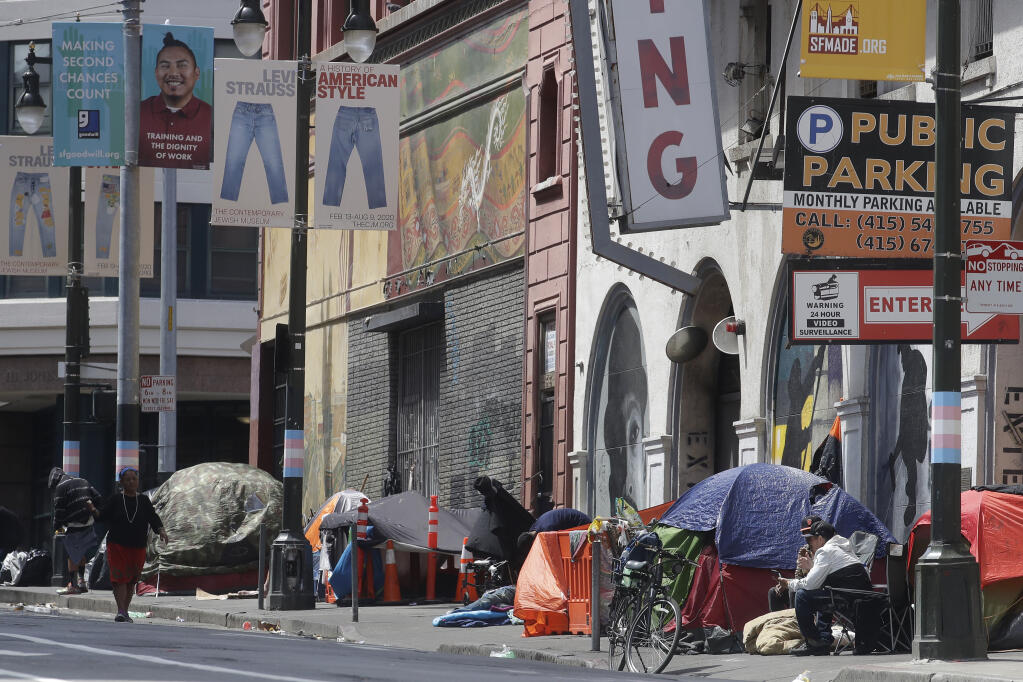 FILE - Tents line a sidewalk in the Tenderloin neighborhood of San Francisco on April 18, 2020. (AP Photo/Jeff Chiu, File)