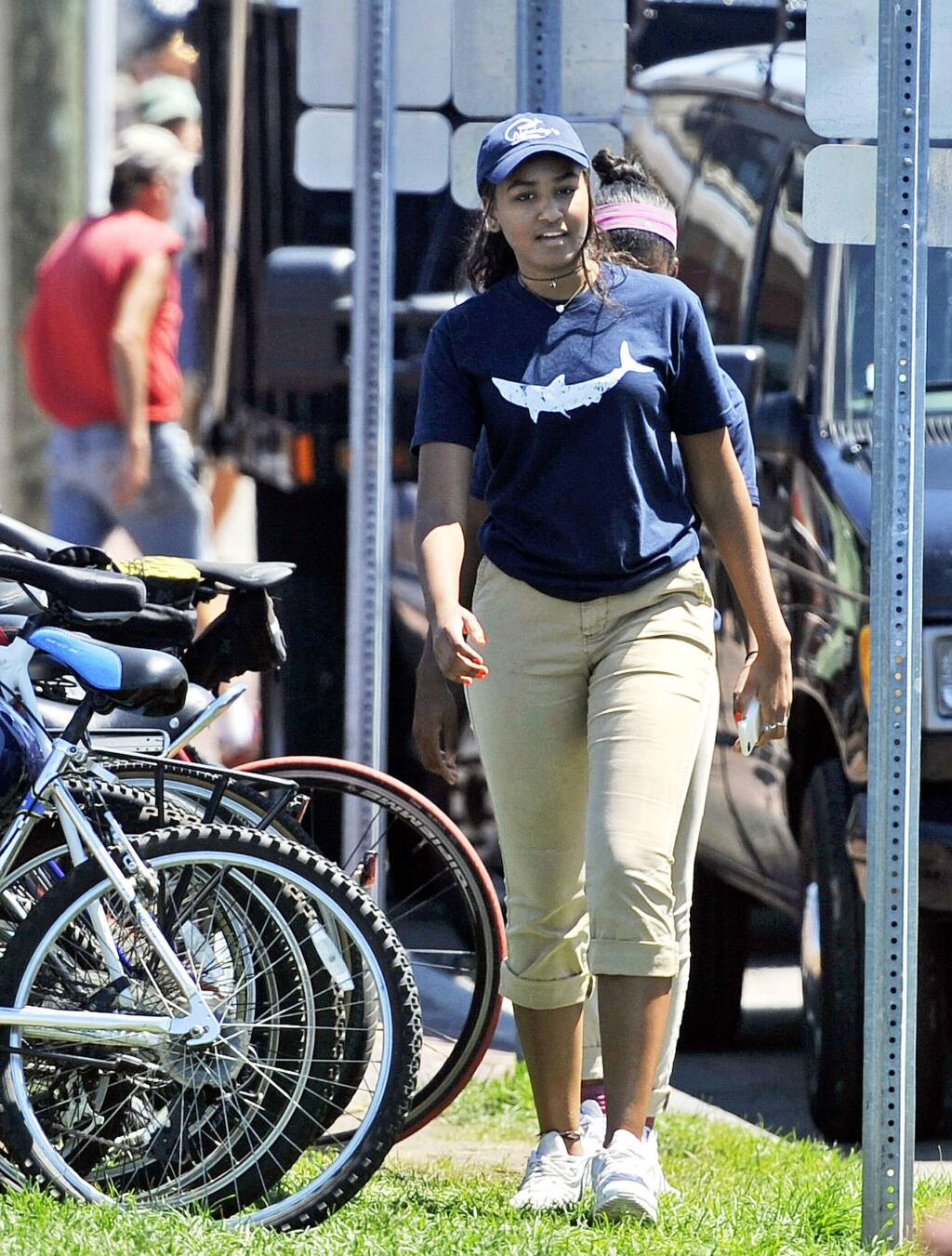 In this Wednesday, Aug. 3, 2016 photo Sasha Obama, daughter of President Barack Obama, departs Nancy's Restaurant after working her shift there, in Oak Bluffs, Mass., on the island of Martha's Vineyard. (Boston Herald, Christopher Evans via AP)