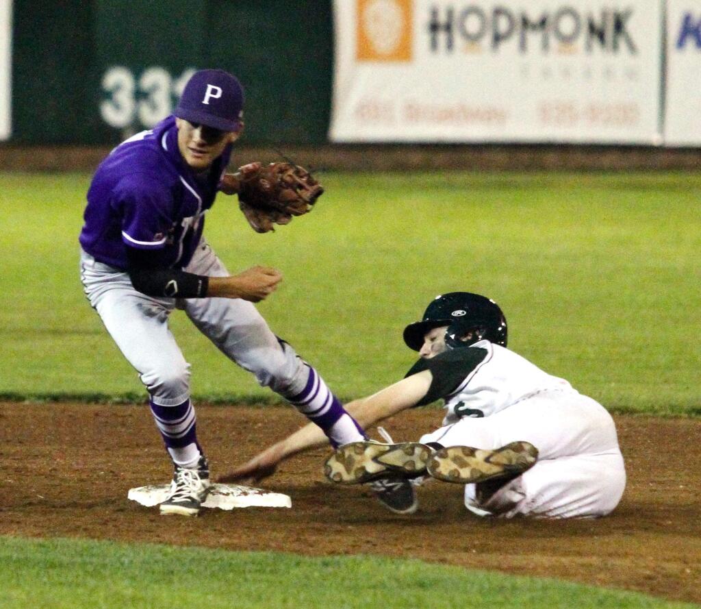 Bill Hoban/Index-TribuneSophomore Carson Snyder (right) reaches second base during the Dragons earlier SCL victory over longtime rival Petaluma at Arnold Field. On Tuesday in Petaluma, the Sonoma boys were upended by the Trojans and both teams sit atop the standings with one loss each.