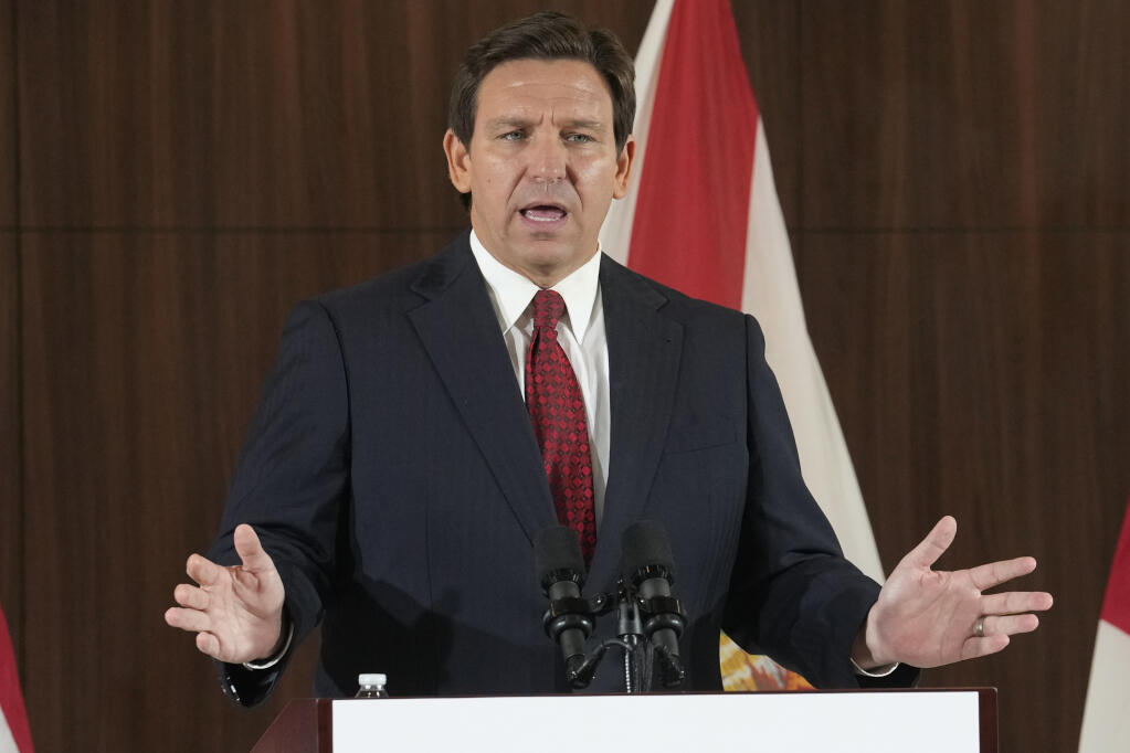 FILE - Florida Gov. Ron DeSantis speaks at a news conference on Jan. 26, 2023, in Miami. David McIntosh, the president of the influential Club For Growth group, said Tuesday, Feb. 7, that the group has invited a half dozen potential Republican candidates for the White House to its donor summit in Florida next month including DeSantis. (AP Photo/Marta Lavandier, File)