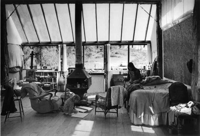 Bill Wheeler's studio that ultimately burned down. Gwen, his wife at the time is seated on the bed. (Courtesy badabamama.com)