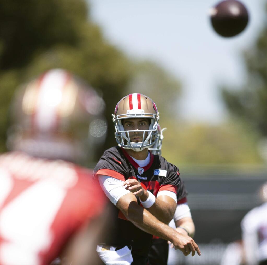 San Francisco 49ers quarterback Jimmy Garoppolo throws a pass during practice at the team's headquarters in Santa Clara, Tuesday, June 12, 2018. (AP Photo/D. Ross Cameron)