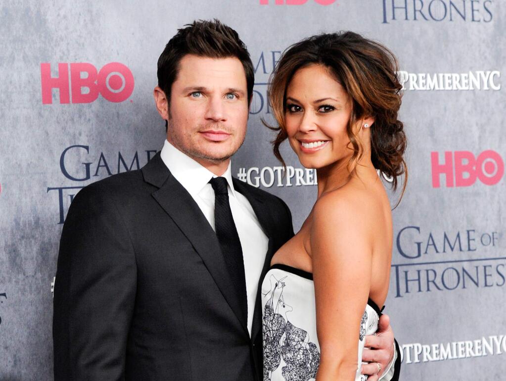 FILE - This March 18, 2014 file photo shows television personalities Nick Lachey, left, and his wife Vanessa Lachey at HBO's 'Game of Thrones' fourth season premiere in New York. The couple are expecting their second baby, their publicists confirm. The singer and ìVH1 Big Morning Buzz Liveî host first made the announcement Tuesday, July 15, on his Twitter account, which also marked the coupleís third wedding anniversary. (Photo by Evan Agostini/Invision/AP, File)