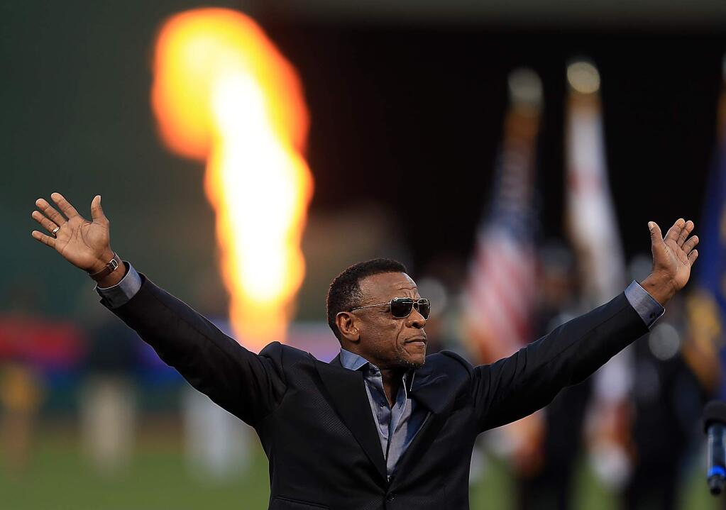 Rickey Henderson acknowledges the Oakland crowd, Monday April 3, 2017, after the field was named in his honor prior to the start of the Athletics' home opener against the Angels. (Kent Porter / The Press Democrat)