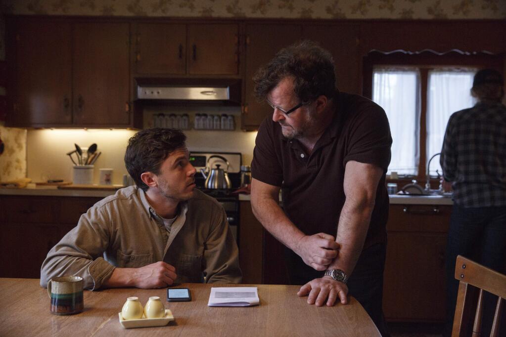 This image released by Roadside Attractions and Amazon Studios shows Casey Affleck, left, with writer-director Kenneth Lonergan during the filming of 'Manchester by the Sea.' (Claire Folger/Roadside Attractions and Amazon Studios via AP)