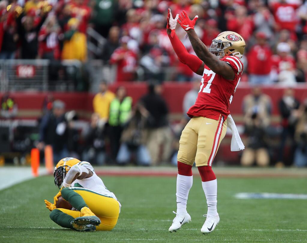 San Francisco 49ers linebacker Dre Greenlaw celebrates his tackle of Green Bay Packers running back Jamaal Williams during the NFC championship game at Levi's Stadium in Santa Clara on Sunday, Jan. 19, 2020. (Christopher Chung / The Press Democrat)