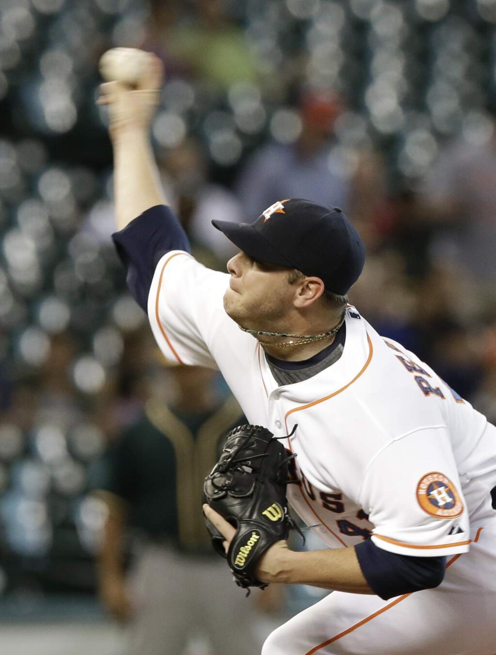 Houston Astros' Brad Peacock delivers a pitch against the Oakland Athletics in the first inning of a baseball game Wednesday, Aug. 27, 2014, in Houston. (AP Photo/Pat Sullivan)