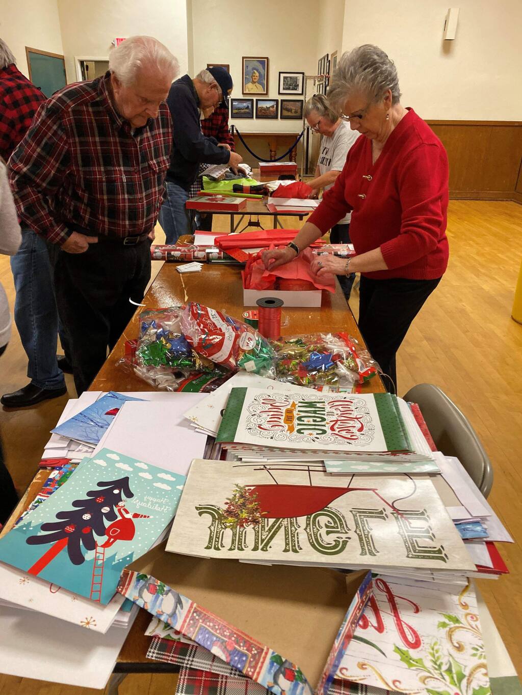 AMVETS volunteers stuffed dozens of boxes with Christmas gifts for veterans. (Emily Charrier/Index-Tribune)