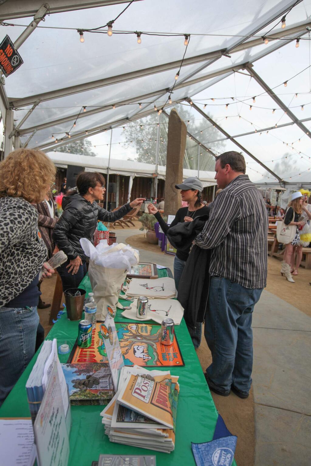 Mike Harris checks out the raffle goods at the Butter and Egg Days Kickoff Party Fundraiser at Lagunitas Brewery on Monday, April 6th, 2015. (Victoria Webb/For The Argus-Courier)
