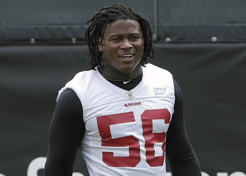 FILE - In this May 30, 2018, file photo, San Francisco 49ers linebacker Reuben Foster walks on the field during a practice at the team's NFL football training facility in Santa Clara, Calif. Foster was arrested Saturday, Nov. 24, at the team hotel on charges of domestic violence. (AP Photo/Jeff Chiu, File)