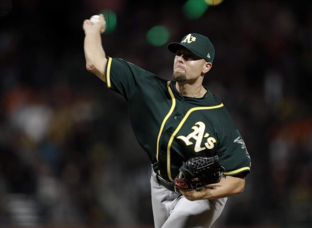Oakland Athletics relief pitcher Blake Treinen throws to a San Francisco Giants batter during the ninth inning Saturday, July 14, 2018, in San Francisco. (AP Photo/Marcio Jose Sanchez)