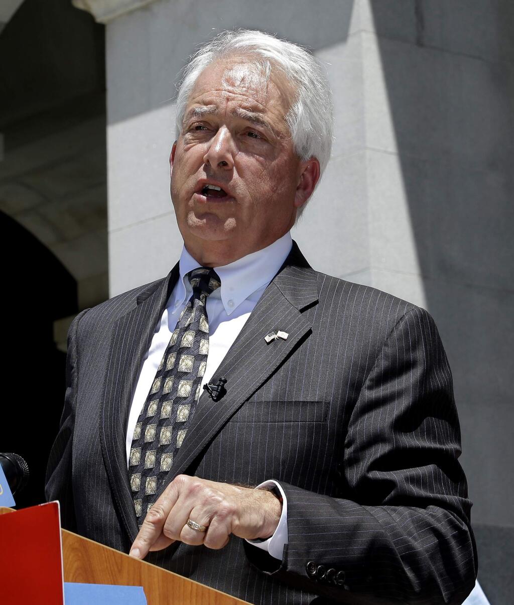 Republican gubernatorial candidate John Cox blasts a recent gas tax increase during a news conference Monday, June 18, 2018, in Sacramento, Calif. Cox is the chairman of a campaign to repeal the gas tax increase and faces Democratic Lt. Gov. Gavin Newsom in November. (AP Photo/Rich Pedroncelli)