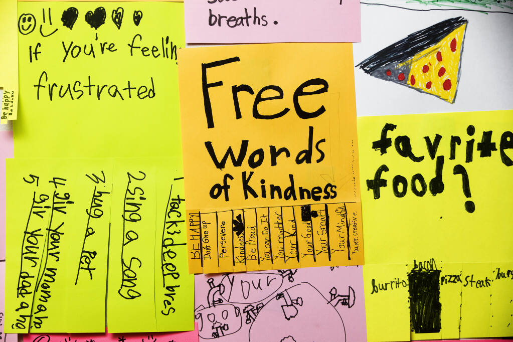 Artist Jessica Martin created the “PepToc Hotline,” a phone message service with words of wisdom and positive messages from her students at West Side Elementary School in Healdsburg. Students put up flyers around town and an exhibit in the Healdsburg Center for the arts on Thursday, March 3, 2022. (John Burgess / The Press Democrat)