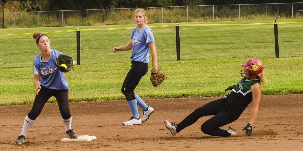 RICH LANGFORD/FOR THE ARGUS-COURIEREmily Corda has a force out and is about to try for a double play while teammate sarah Mills backs up the play. The under-16 Breeze concluded its season by winning two tournaments.