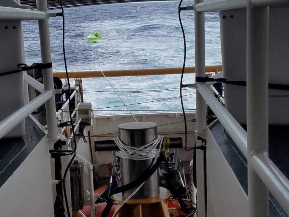 This photo provided by the U.S. Coast Guard shows the rescue Tuesday, Nov. 7, 2017, of Ruihn Yu, a Chinese national, who was reportedly conducting a trans-Pacific voyage from California to port calls in China and Taiwan aboard his 18-foot vessel when he suffered communication failures and a damaged rudder. (U.S. Coast Guard via AP)