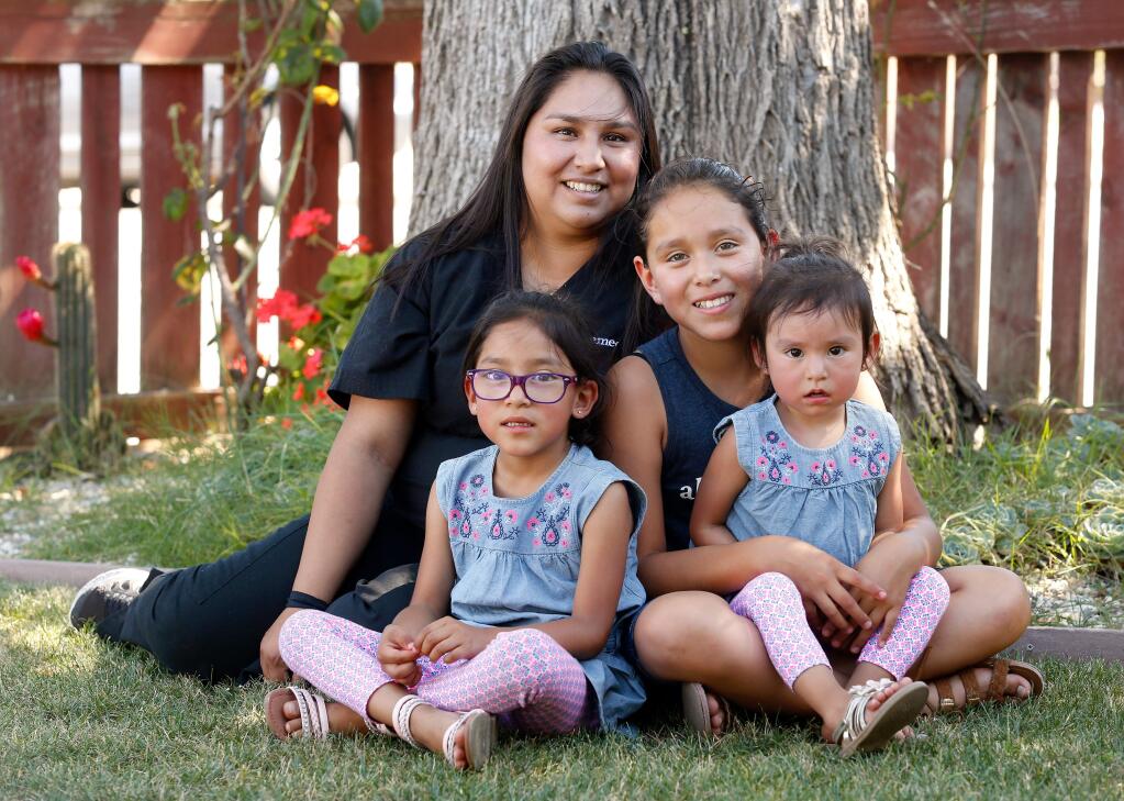 Ivonne Sonato-Vega with her daughters Montserrat Silva-Sonato, 11, Citlali Silva-Sonato, 6, and Maya, Silva-Sonato, 2, at their home in Santa Rosa, California on Friday, June 16, 2017. (Alvin Jornada / The Press Democrat)