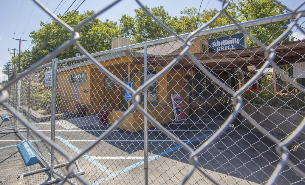 The parking lot beside the Schellvlle Grill is now fenced off, leaving the restaurant's patrons to park either across the street or alongside the fence. (Photos by Robbi Pengelly/Index-Tribune)
