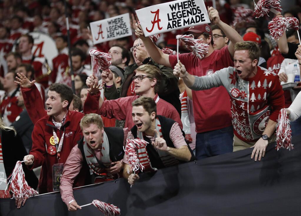 Fans cheer during the second half of the NCAA college football playoff championship game between Georgia and Alabama Monday, Jan. 8, 2018, in Atlanta. (AP Photo/David Goldman)
