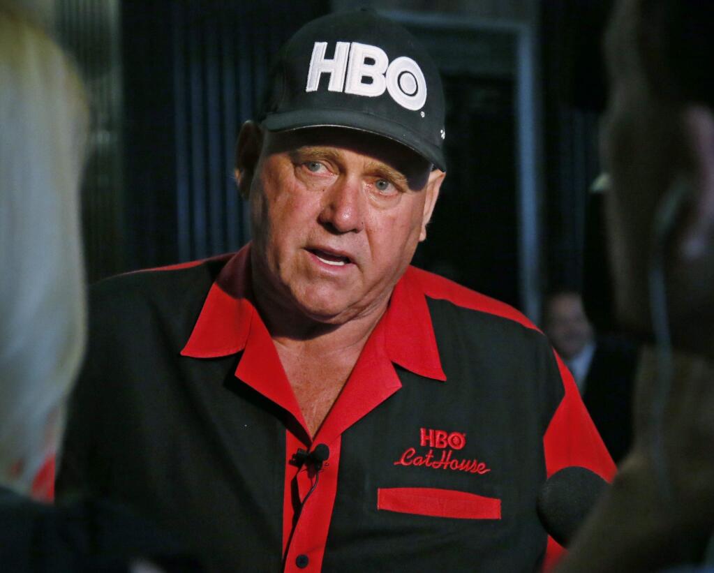FILE - In this June 13, 2016, file photo, Dennis Hof, owner of the Moonlite BunnyRanch, a legal brothel near Carson City, Nevada, is pictured during an interview in Oklahoma City. Hof, who died last month after fashioning himself as a Donald Trump-style Republican candidate has won a heavily GOP state legislative district. Hof defeated Democratic educator Lesia Romanov on Tuesday, Nov. 8, 2018 in the race for Nevada's 36th Assembly District. (AP Photo/Sue Ogrocki, File)