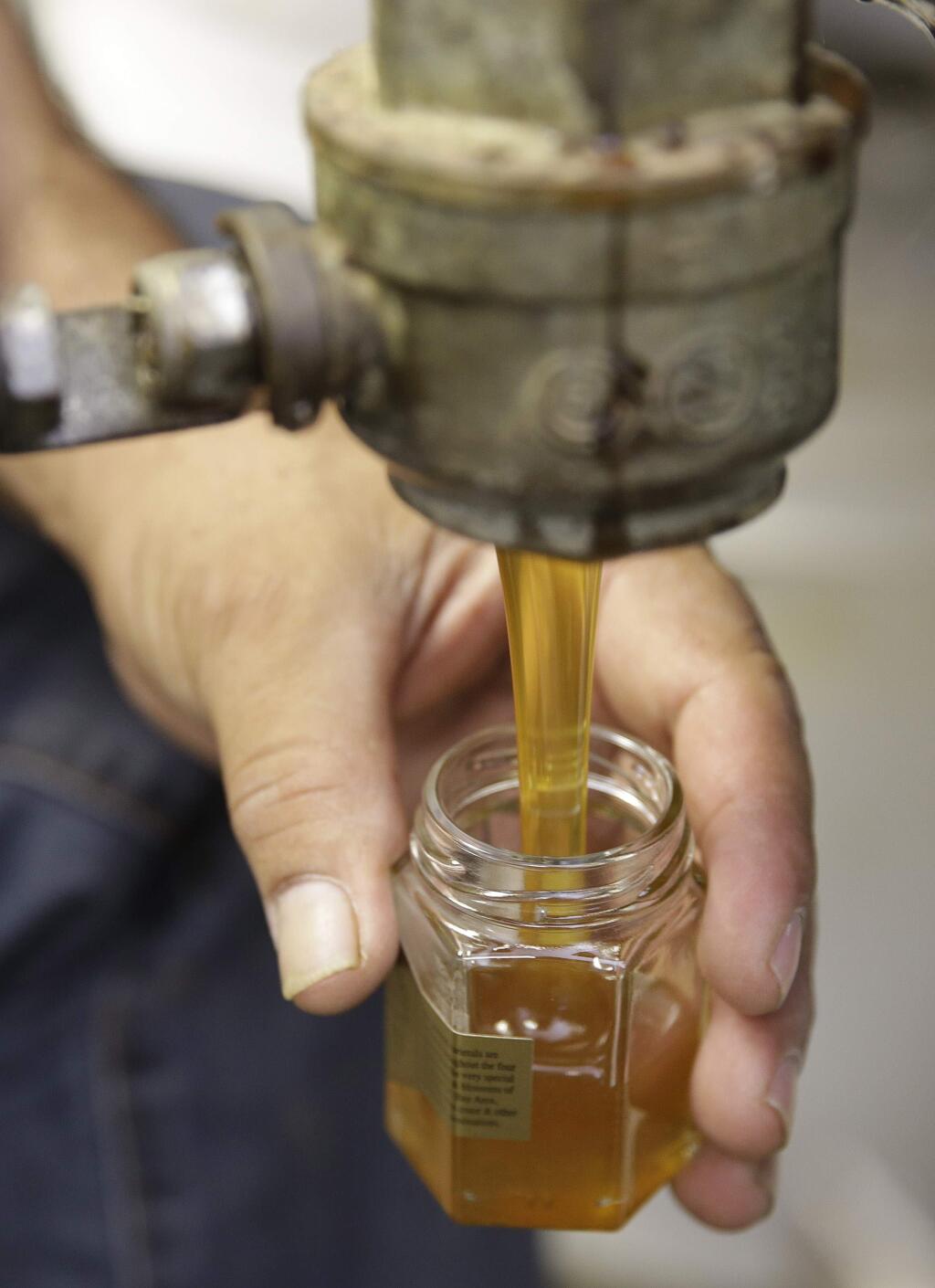Honey freshly harvested. (AP Photo/Eric Risberg)