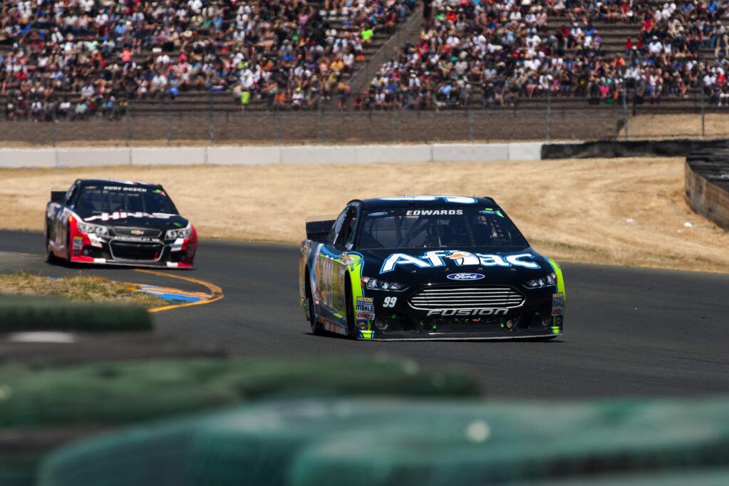 James Fanucchi/Index-TribuneCarl Edwards drives his No. 99 Ford to the 2014 NASCAR Toyota/Save Mart 350 title victory at Sonoma Raceway to become the 10th different winner in the past 10 years. 