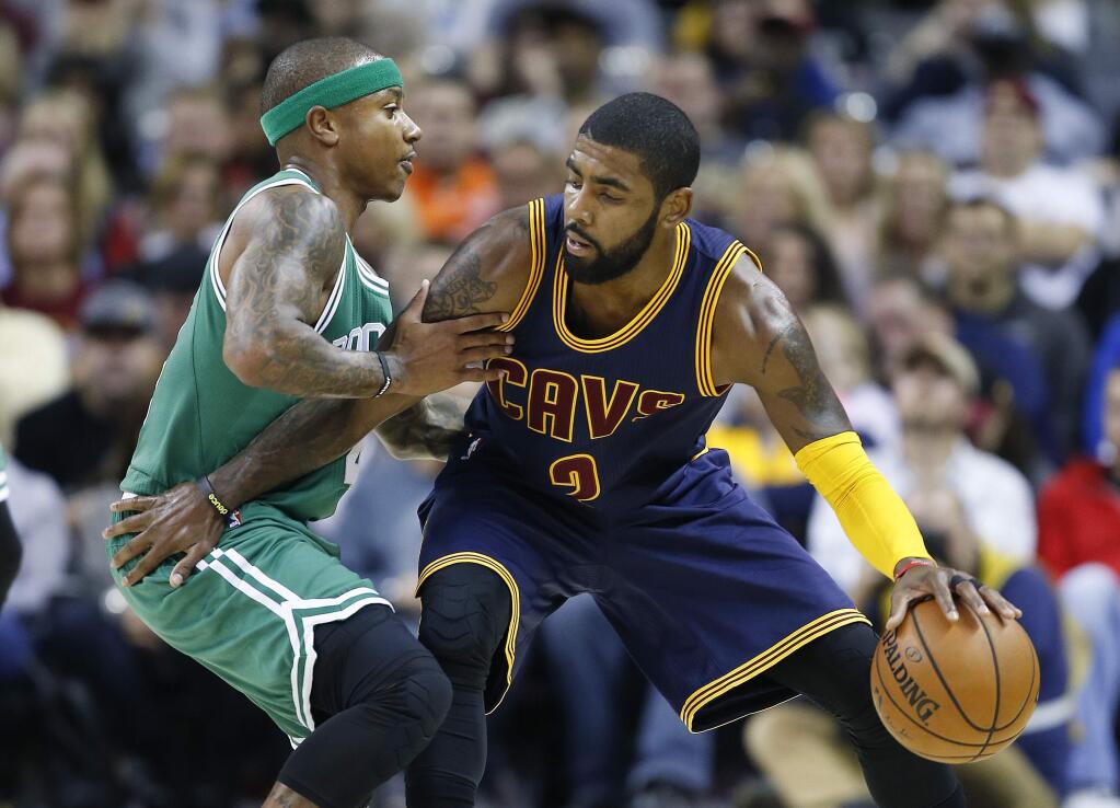 In this Nov. 3, 2016, file photo, the Cleveland Cavaliers' Kyrie Irving, right, looks to drive against the Boston Celtics' Isaiah Thomas during the first half of a game in Cleveland. (AP Photo/Ron Schwane, File)