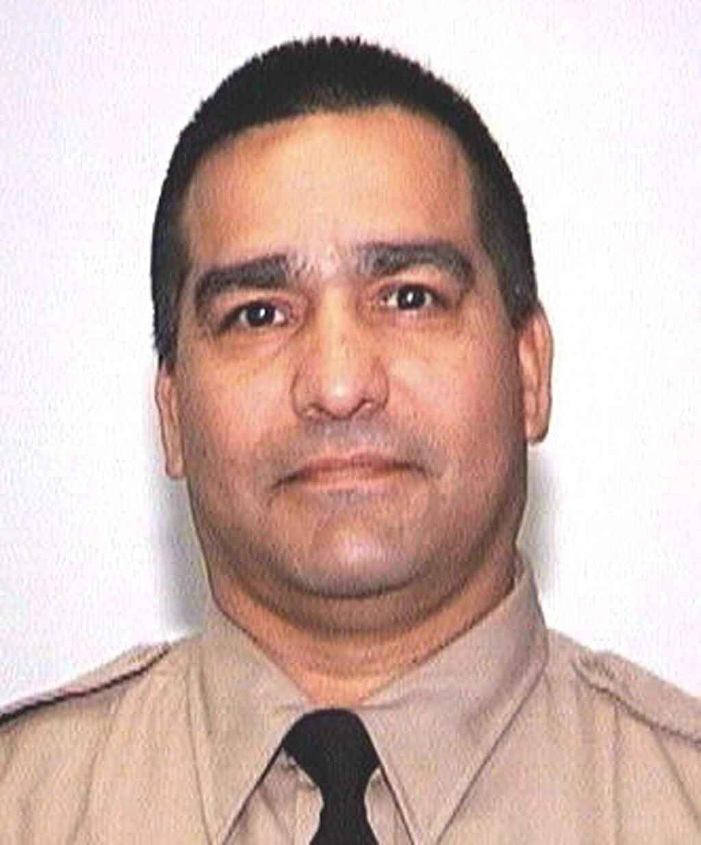 This undated photo provided by the California Department of Corrections and Rehabilitation shows corrections officer Armando Gallegos. Authorities said Gallegos, 56, died five months after he and another officer were attacked by a dozen inmates April 21, 2018 at Kern Valley State Prison in Delano, Calif. The CDCR said Gallegos died at a hospital Sept. 14, 2018. The guards' union believes his death is related to injuries from the assault, but the official cause is pending a coroner's report. (California Department of Corrections and Rehabilitation via AP)