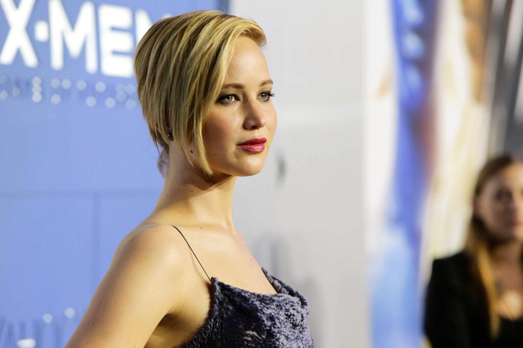 FILE - In this May 10, 2014 file photo released by Twentieth Century Fox, actress Jennifer Lawrence attends the global premiere of 'X-Men: Days of Future Past,' in New York. Lawrence, 24, is speaking out about those nude photos that were stolen via hacking and posted online in an exclusive interview with Vanity Fair for its November issue. The Nov. issue of Vanity Fair goes on sale Oct. 14. (AP Photo/Twentieth Century Fox, Eric Charbonneau, File)