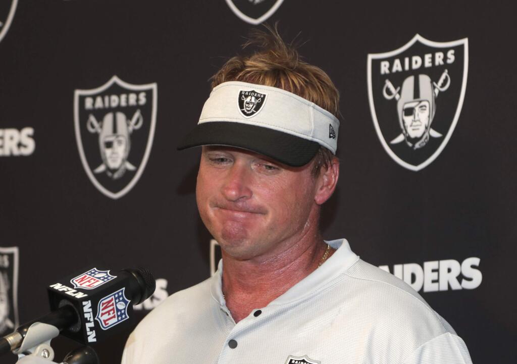 Oakland Raiders head coach Jon Gruden speaks during a news conference after an NFL football game against the Miami Dolphins, Sunday, Sept. 23, 2018, in Miami Gardens, Fla. The Dolphins won 28-20. (AP Photo/Lynne Sladky)