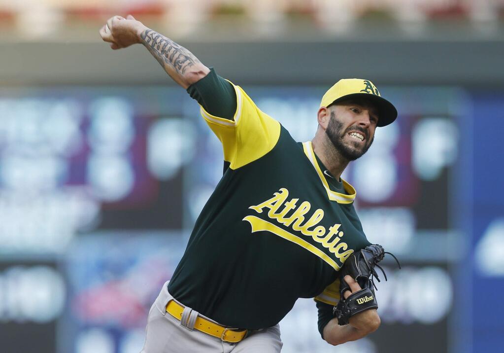 Oakland Athletics starting pitcher Mike Fiers throws against the Minnesota Twins in the first inning Saturday, Aug. 25, 2018, in Minneapolis. (AP Photo/Jim Mone)
