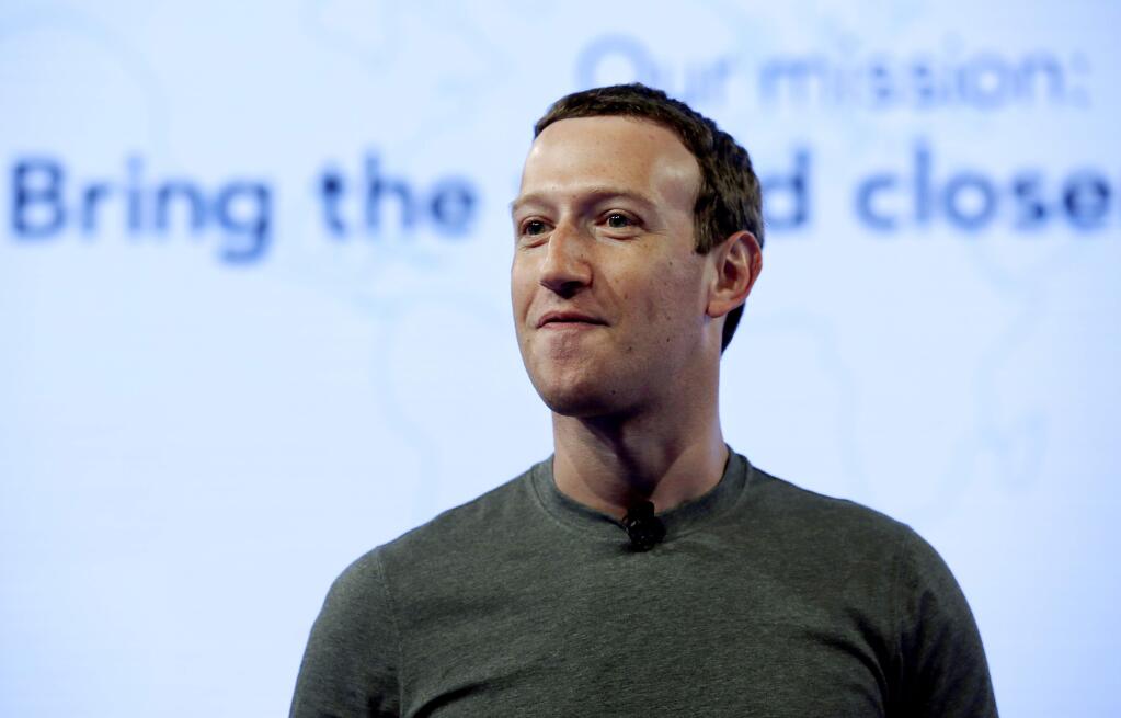 FILE - In this June 21, 2017, file photo, Facebook CEO Mark Zuckerberg speaks during preparation for the Facebook Communities Summit, in Chicago. Zuckerberg embarked on a rare media mini-blitz Wednesday, March 22, 2018, in the wake of a privacy scandal involving a Trump-connected data-mining firm. (AP Photo/Nam Y. Huh, File)
