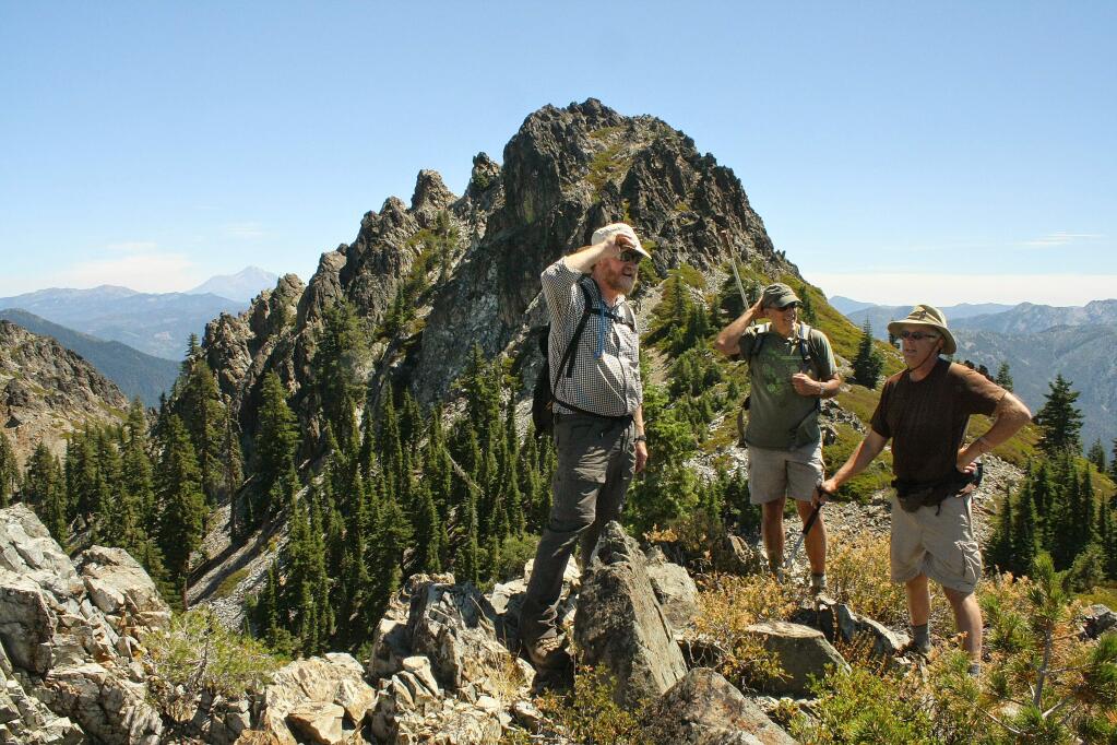 Steve Morris, left, Tim Bowen and Jim Bankson pause on a ridge in the Trinity Alps on Aug. 2. It is one of the last photos taken of Morris before he disappeared. (COURTESY OF BOB SHOULDERS)
