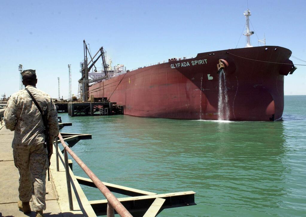 A tanker loads Iraqi oil at the offshore terminal at Khawr Al Amaya. (HASAN JAMALI / Associated Press, 2003)
