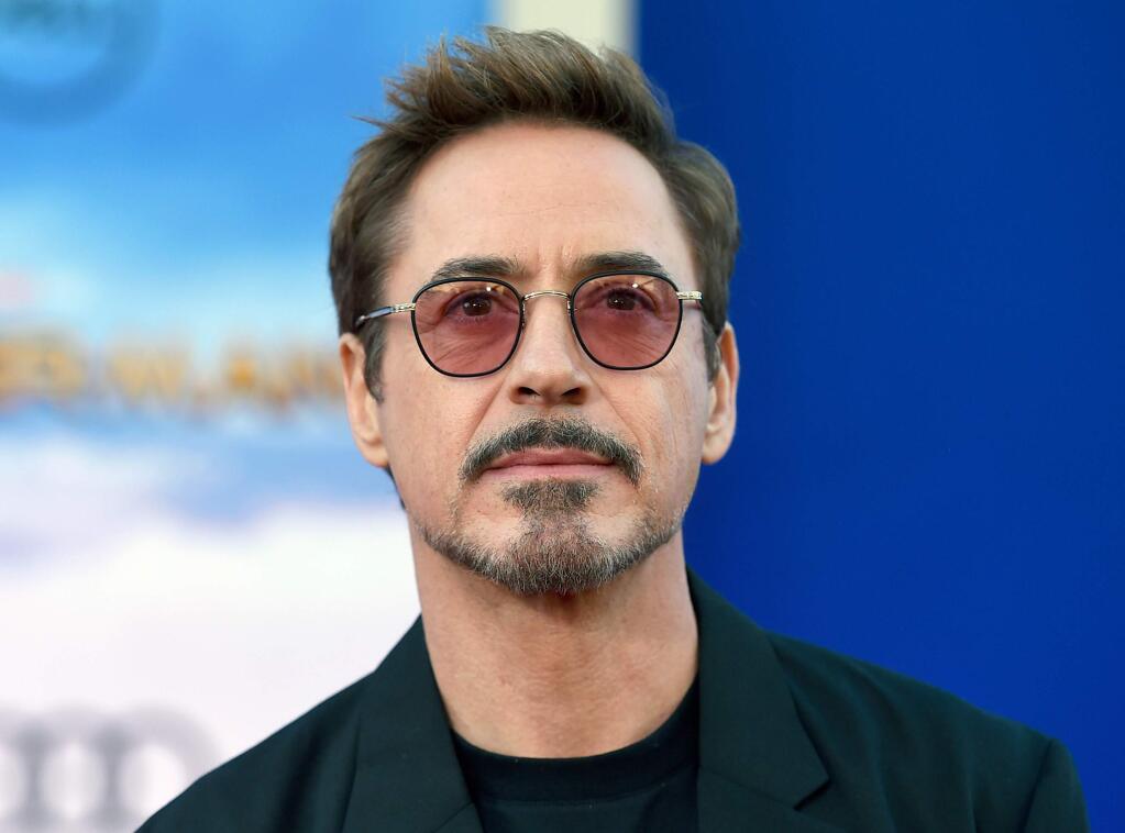 FILE - In this June 28, 2017 file photo, Robert Downey Jr. arrives at the Los Angeles premiere of 'Spider-Man: Homecoming.' Downey Jr. is joining the directors of 'Avengers: Infinity War' in calling for fans to maintain secrecy. Directors Joe and Anthony Russo went on Twitter to tell fans they would be screening a limited amount of footage prior to the film's release on April 27. They asked fans to maintain the same level of secrecy so that they don't spoil it for others. (Photo by Jordan Strauss/Invision/AP, File)