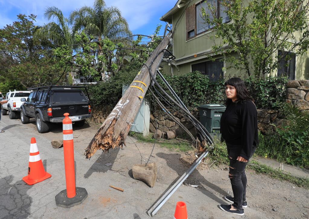 A miffed Cynthia Sanchez said it 'Felt like an earthquake' when a utility pole fell on top of her home in Boyes Hot Springs, Friday, April 19, 2019. The home sustained minor damage and no one was injured. (Kent Porter / The Press Democrat) 2019