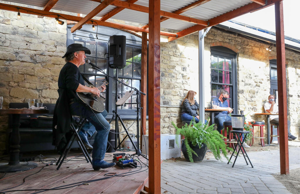 Ricky Ray performs in front of a socially distanced audience in the outdoor beergarden at Hopmonk Tavern in Sebastopol on Wednesday, March 24, 2021.  (Christopher Chung/ The Press Democrat)
