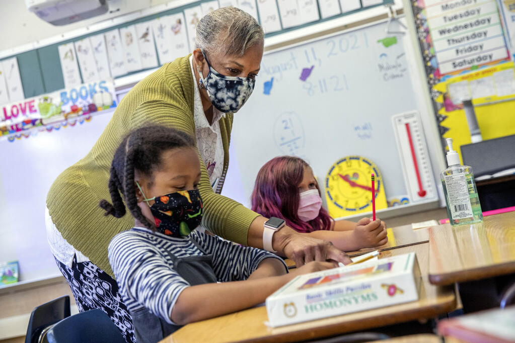 FILE — Joy Harrison instructs her second graders at Carl B. Munck Elementary School, in Oakland, Calif,, Aug. 11, 2021. (Santiago Mejia/San Francisco Chronicle via AP, Pool, File)
