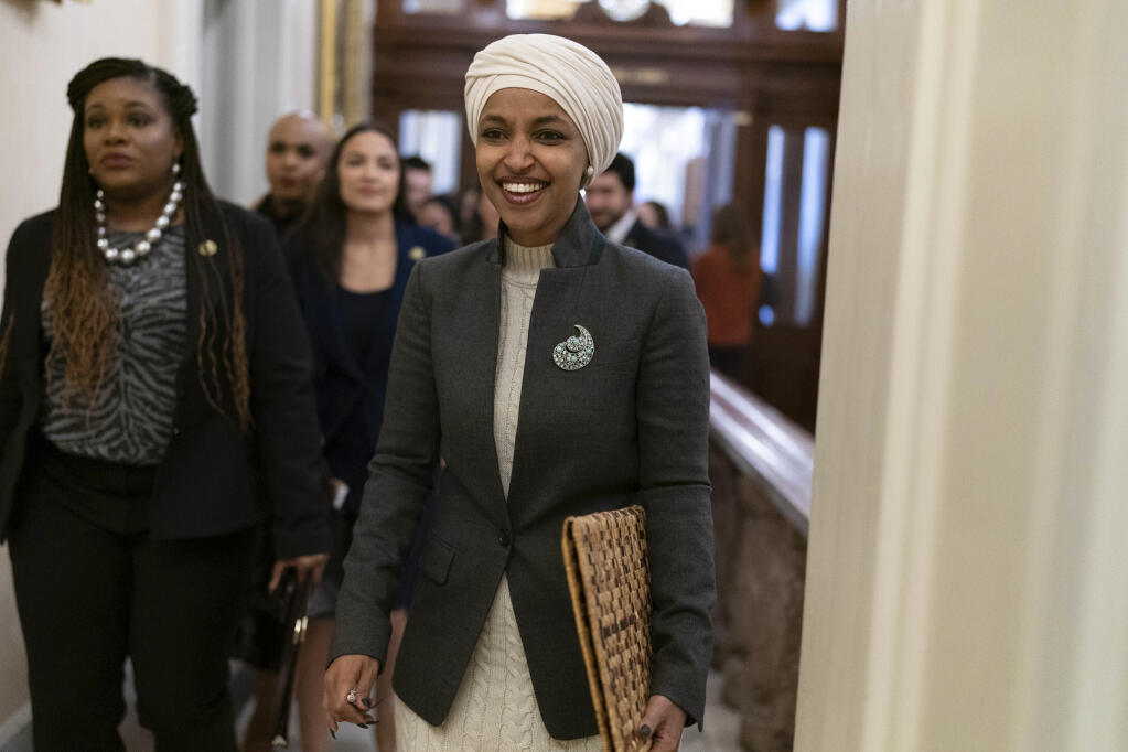 Rep. Ilhan Omar, D-Minn., leaves the House chamber at the Capitol in Washington, Thursday, Feb. 2, 2023. House Republicans have voted to oust Omar from the House Foreign Affairs Committee. The vote in a raucous session on Thursday to remove the Somali-born Muslim lawmaker came after her past comments critical of Israel. (AP Photo/Jose Luis Magana)