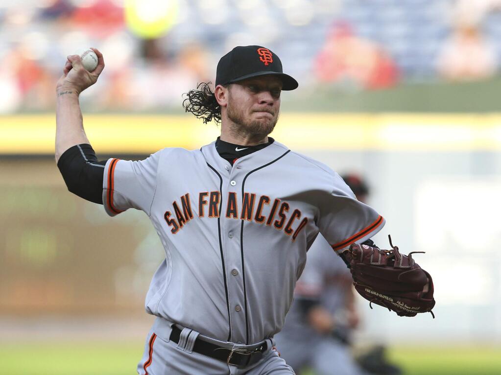 San Francisco Giants starting pitcher Jake Peavy works against the Atlanta Braves during the first inning of a baseball game Tuesday, May 31, 2016, in Atlanta. (AP Photo/John Bazemore)