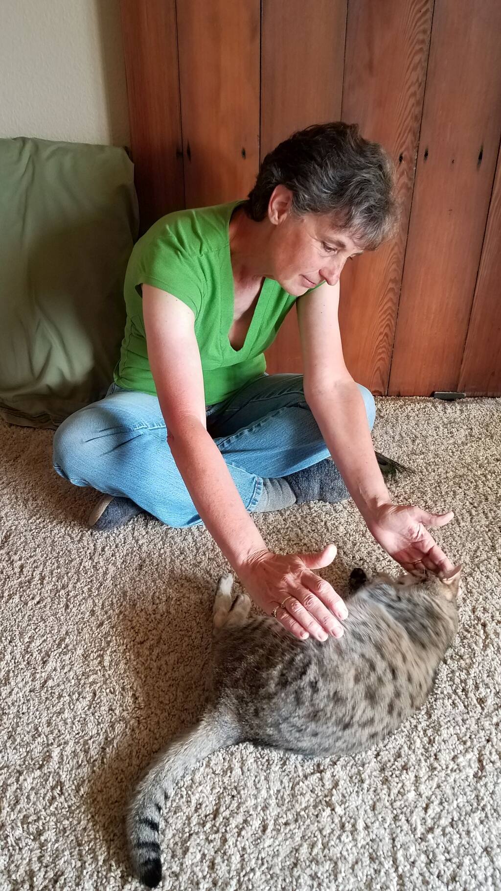 Sally Carstensen of Garden Path Healing Center sends Reiki to her cat.  She has moved to Zoom healing sessions during shelter in place.