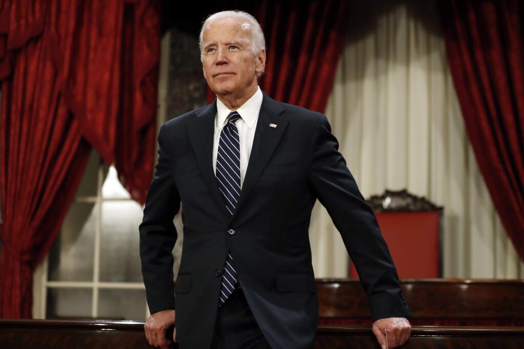 File- This Jan. 3, 2017, file photo shows former Vice President Joe Biden pausing between mock swearing in ceremonies in the Old Senate Chamber on Capitol Hill in Washington. (AP Photo/Alex Brandon, File)