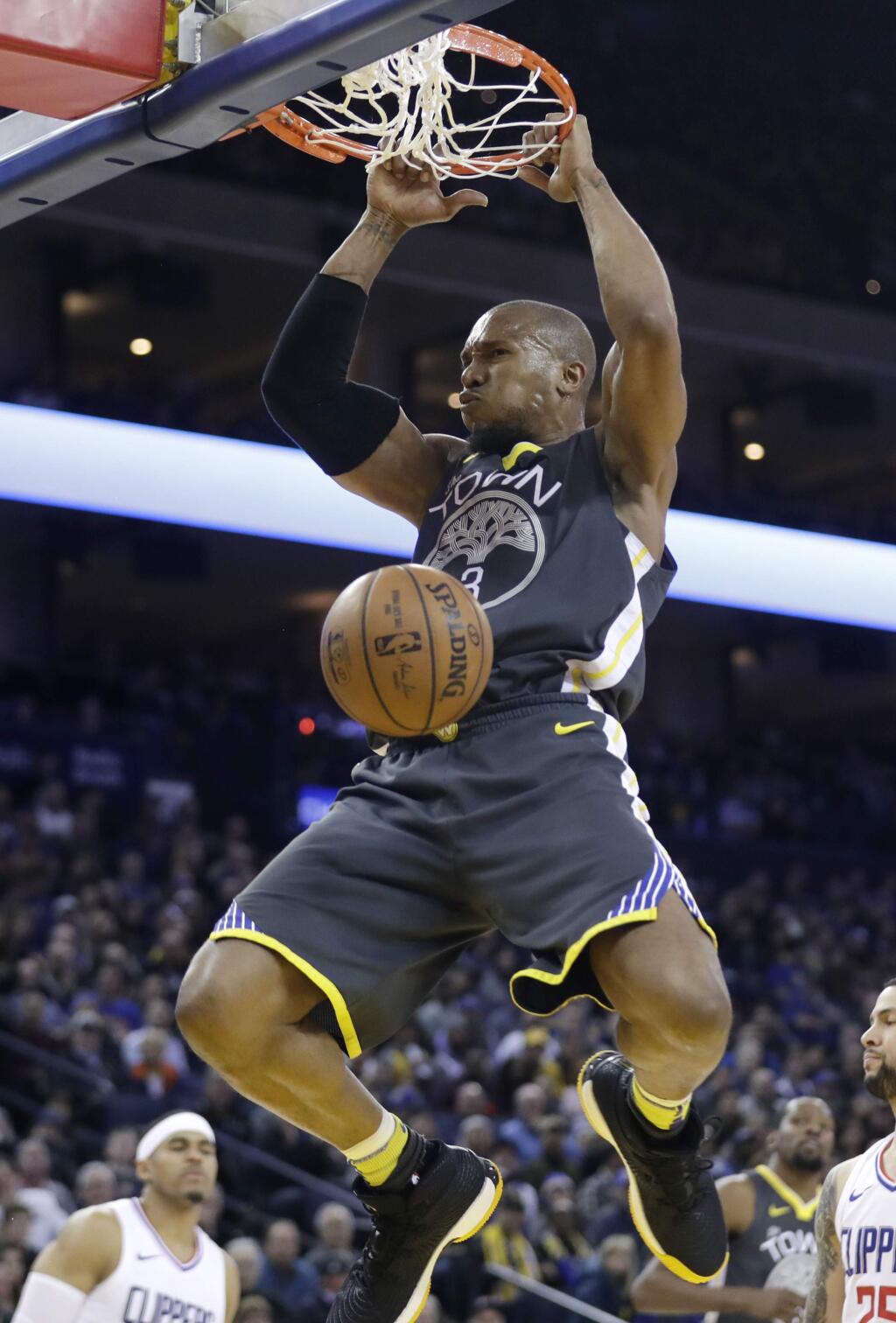 FILE - In this Feb. 22, 2018, file photo, Golden State Warriors' David West dunks against the Los Angeles Clippers during the second half of an NBA basketball game in Oakland, Calif. West, a key big man off the bench for the Golden State Warriors' past two championship seasons, has retired. And he gets to go out on top, too. West's Twitter announcement on Thursday, Aug. 31, 2018, one day after his 38th birthday, wasn't a surprise as he made it clear he would take some time after the team's latest title run to contemplate his future and the idea of calling it a career. (AP Photo/Marcio Jose Sanchez, File)
