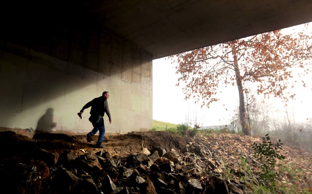 Dean Talent of Santa Rosa searches for the homeless under the Dutton Ave. bridge at Santa Rosa Creek in Santa Rosa, during Sonoma County's homeless count, Friday Jan. 23, 2015. (Kent Porter / Press Democrat) 2015