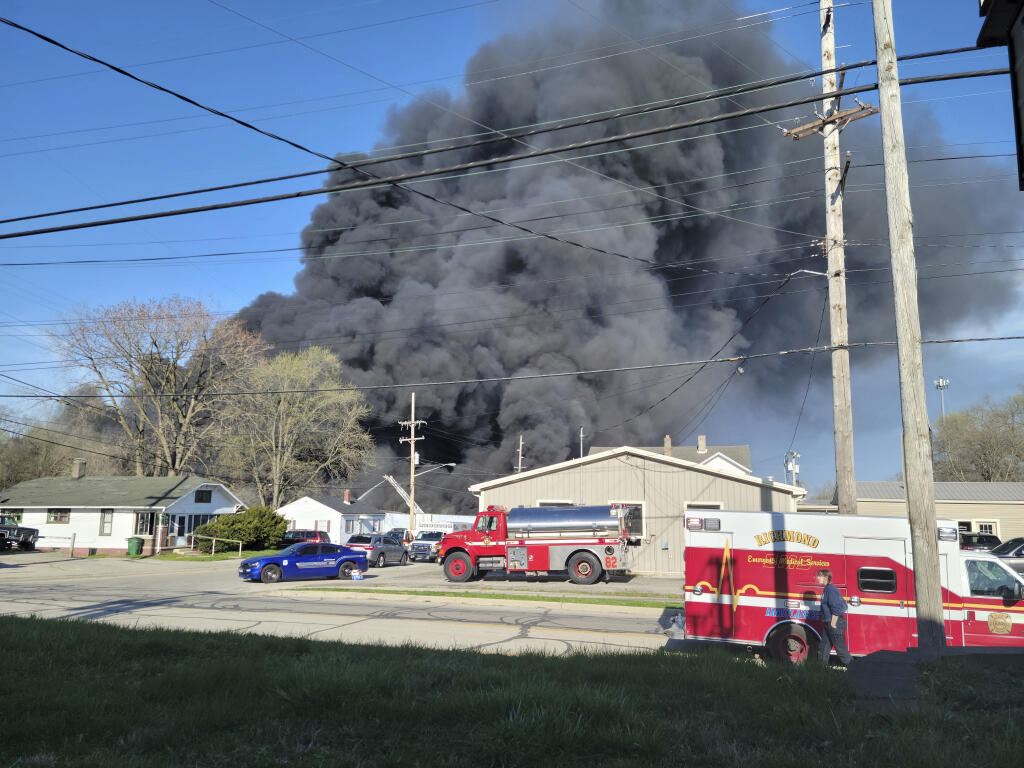 Smoke rises from an industrial fire, Tuesday, April 11, 2023, at 358 NW F Street, in Richmond, Ind. (Zach Piatt/The Palladium-Item via AP)