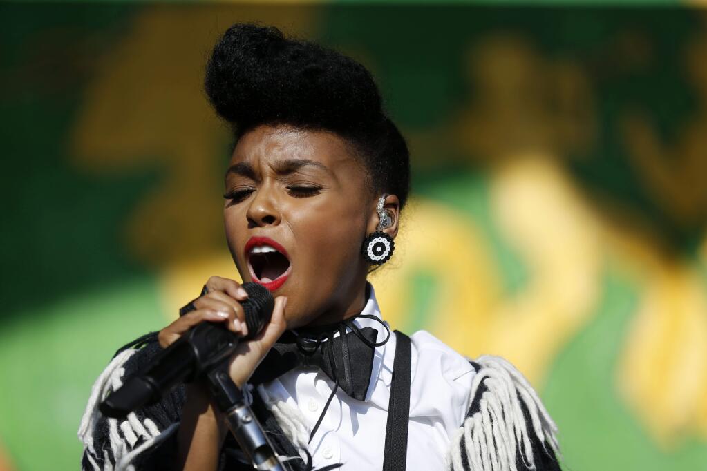Janelle Monáe performs at the New Orleans Jazz and Heritage Festival in New Orleans, Friday, April 22, 2016. Monáe is one of the performers slated for this summer's free Stern Grove Festival in San Francisco. (AP Photo/Gerald Herbert)
