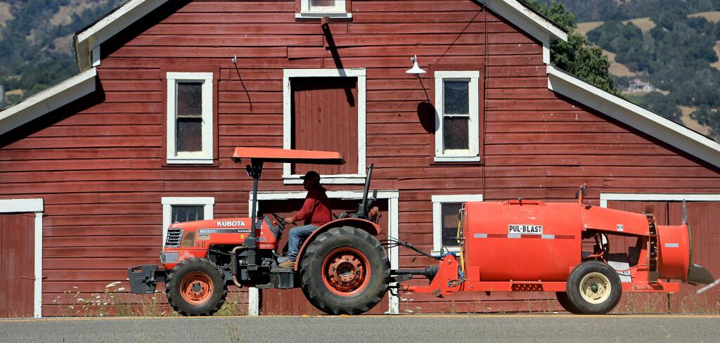 The landmark red barn at the corner of Canyon Road and Highway 128 in Geyserville, Thursday, July 18, 2019. (Kent Porter / The Press Democrat) 2019