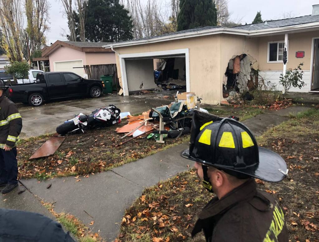 A house on Maria Drive in Petaluma was damaged after a car slammed into it, Wednesday, Dec. 4, 2019. (BETH SCHLANKER/ PD)