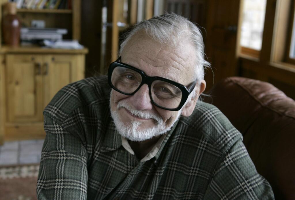 FILE - In this Monday, Jan. 21, 2008 file photo, director and writer George Romero poses for a photograph while talking about his film 'Diary of the Dead' at the Sundance Film Festival in Park City, Utah. George Romero, whose classic 'Night of the Living Dead' and other horror films turned zombie movies into social commentaries and who saw his flesh-devouring undead spawn countless imitators, remakes and homages, has died. He was 77. Romero died Sunday, July 16, 2017 following a battle with lung cancer. (AP Photo/Amy Sancetta, File)
