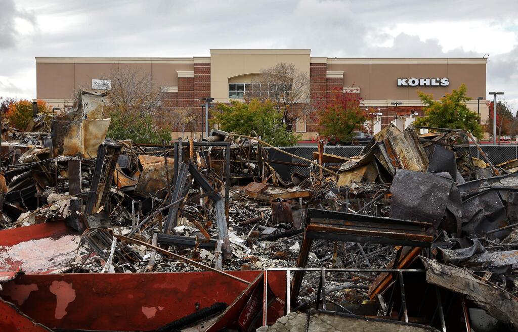 The Kohl's retail store stands, although closed for business, next to the burned down Applebee's restaurant in Santa Rosa on Thursday, November 16, 2017. (Christopher Chung/ The Press Democrat)
